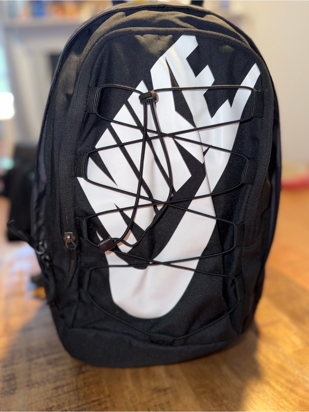 Nike Black Backpack with White Swoosh Graphic and Elastic Bungee